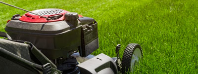 Lawn mower in grass